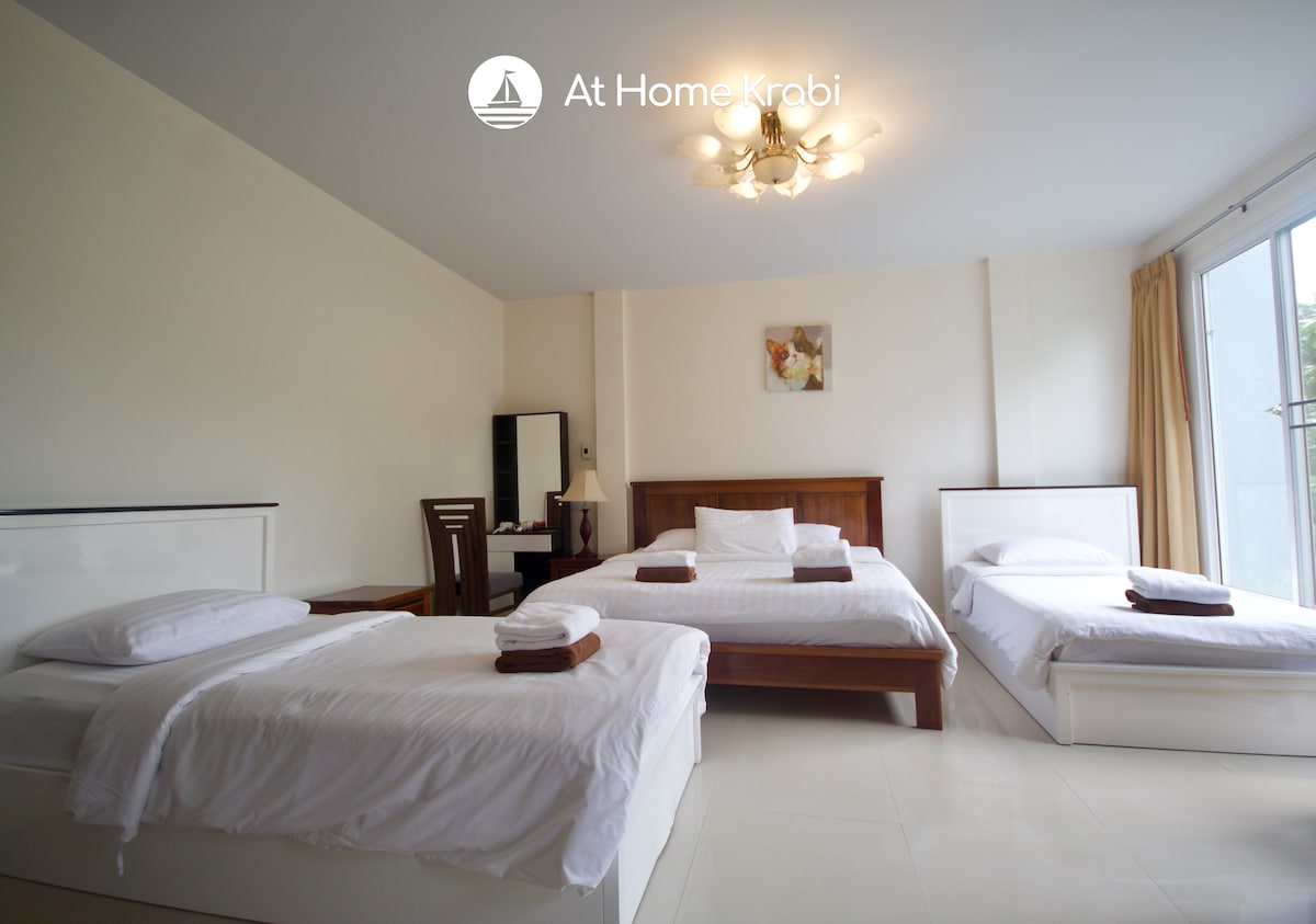 The main bedroom with a King bed and 2 single beds